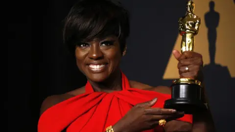 Reuters Viola Davis posing with her award for best supporting actress at the 2017 Oscars