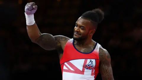 Reuters Britain's Courtney Tulloch reacts during the Men's Rings Final at Munich