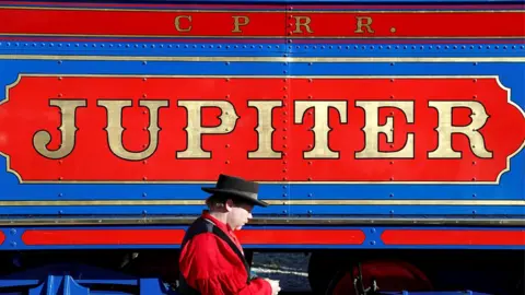 Reuters A man walks past a replica of the historic Jupiter steam locomotive