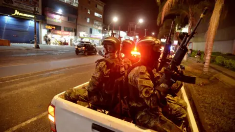 Getty Images Soldiers patrol the Pan-American fields sector a day after protests against the government of Colombian President Iván Duque on May 29, 2021 in Cali