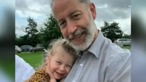 Ava with her grandfather Chris