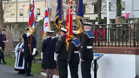 Wreath laying at grave