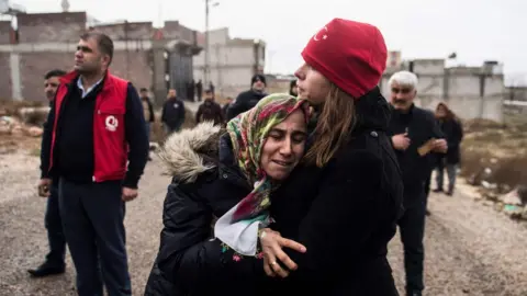 AFP Kilis resident Fevziye Demir cries after a rocket fired from Syria hit her house on 23 January 2018