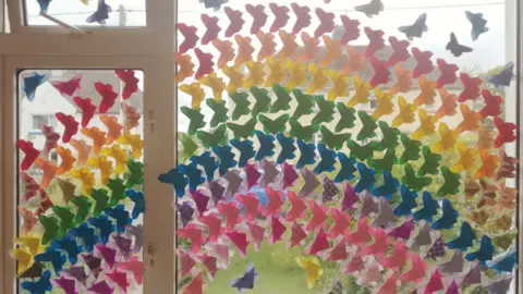 Hannah Bartlett Spare butterflies on the window