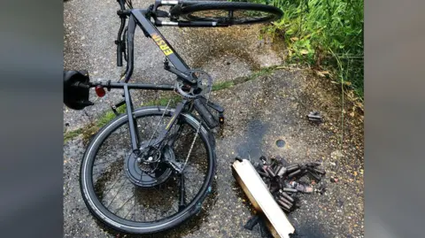 Cambridgeshire Fire and Rescue A damaged e-bike with burned parts 