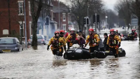 PA Fire and Rescue teams rescuing people out of flooded homes in Carlisle