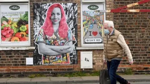 The Postman Art work on wall in York