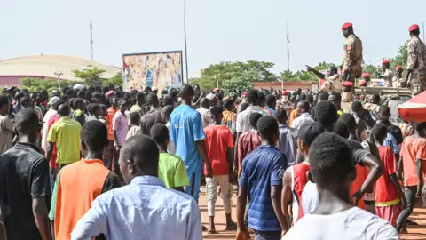 AFP People gather near General Seyni Kountche Stadium in Niamey to join a volenteer force - 19 August 2023