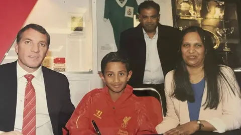 Vimal Yoganathan alongside Brendan Rodgers when he signed for the academy at Liverpool