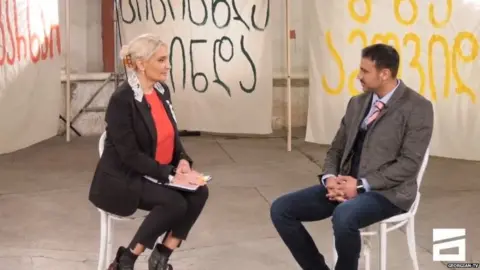 Mtavari Arkhi Shahab Karimi appearing on a TV show