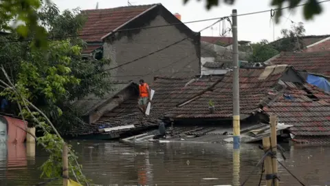 Getty Images Flooded neighbourhood in Jakarta