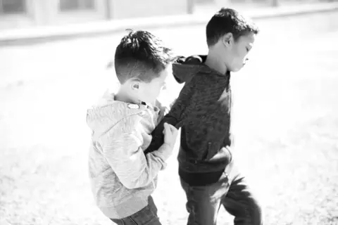 Getty Images boys fighting