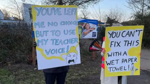 Simon Dedman/BBC Teachers on strike outside Our Lady of Lourdes Catholic Primary School, Southend, Essex