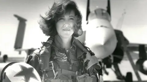 Reuters/US Navy U.S. Navy Lieutenant Tammie Jo Shults, who is currently a Southwest Airlines pilot, poses in front of a Navy F/A-18A in this 1992 photo released in Washington, DC, U.S., April 18, 2018.