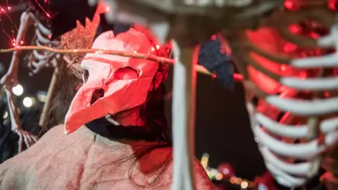 DCSDC Plague doctor-style Halloween costume being worn in a parade