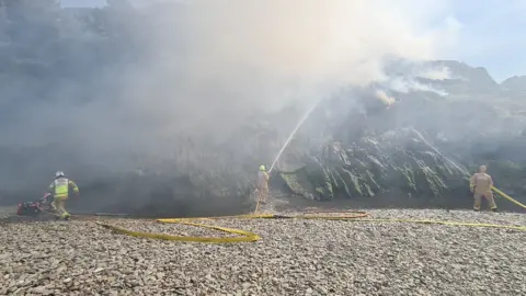 IOM FIRE AND RESCUE SERVICE Fire crews tackling the blaze