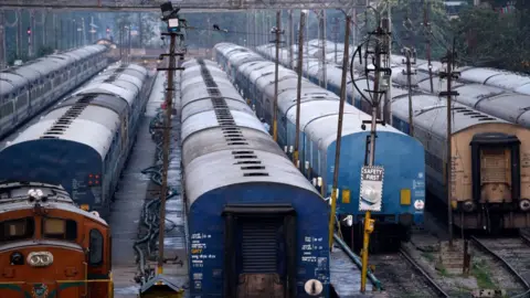 Getty Images Trains are seen parked at Guwahati Railway Station, during nationwide lockdown