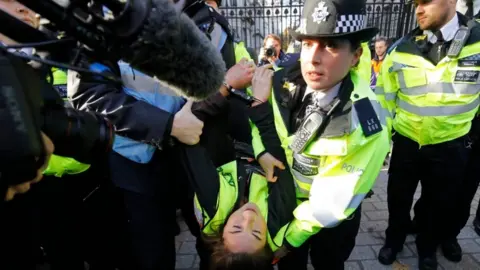 AFP/Getty Images protestor led away