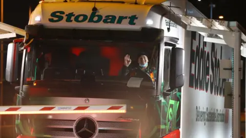 Gareth Fuller The first lorry, driven by Slavi Ivanov Shumeykov, loads onto Le Shuttle at the Eurotunnel in Folkestone, Kent, after the UK leaves the single market and customs union, and transitional trading arrangements expired at 11pm UK time