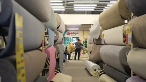 Getty Images Customers in Carpetright store