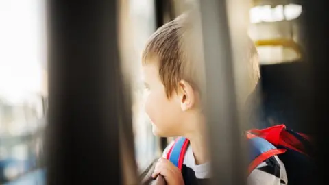 Getty Images Child on bus