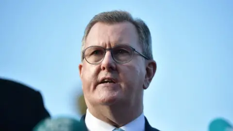 Getty/Charles McQuillan Democratic Unionist party leader Sir Jeffrey Donaldson is pictured during a press conference following discussions at Hillsborough Castle on December 19, 2023 in Belfast, Northern Ireland.