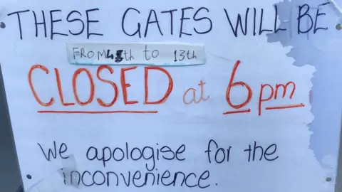 North Wareham Action Group Handwritten sign on level crossing