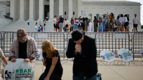 Getty Images Protester for and against abortion at the US Supreme Court