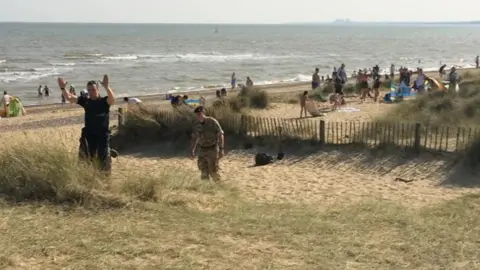 BBC Police and bomb disposal experts on Walberswick beach