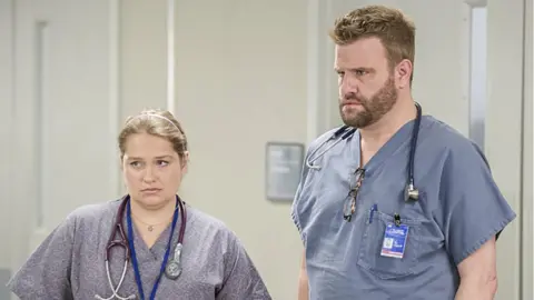 Alamy Merritt Wever won an Emmy Award for her performance as Zoe on Nurse Jackie (seen here with Stephen Wallem)