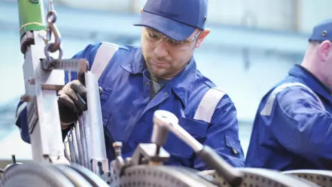 Getty Images Generic image of a man working in a metal workshop