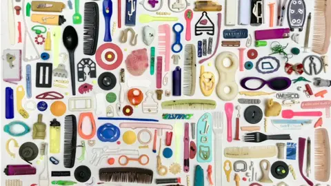 Tracey Williams Colourful items of plastic waste assembled on white background