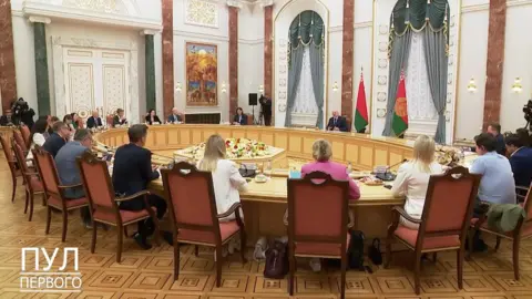 Belarus presidential pool Steve Rosenberg (L by the door) was among a group of journalists who spent four hours with Mr Lukashenko