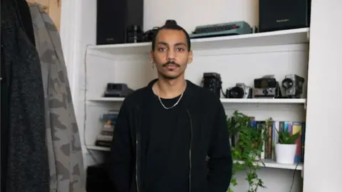 Asher Cutting Picture of Asher Cutting in his home