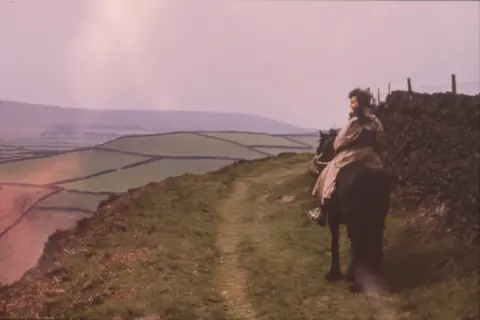 Campaign to Protect Rural England Ethel Haythornthwaite riding a horse with some fields in the background