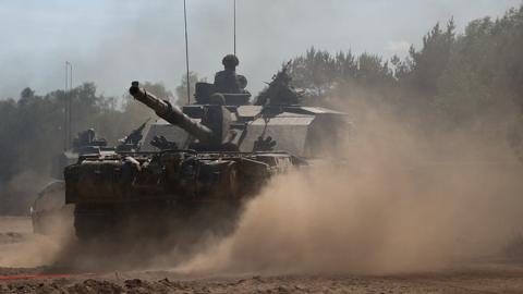 British Army soldiers from Badger Squadron, The Royal Tank Regiment part of the 12th Armoured Brigade Combat Team ride a Challenger 2 tank during Exercise Immediate Response as one component of NATO’s Exercise Steadfast Defender 2024, in Drawsko Pomorskie training area, Poland May 15, 2024