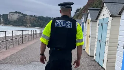 Devon & Cornwall Police Police officer on patrol in Seaton