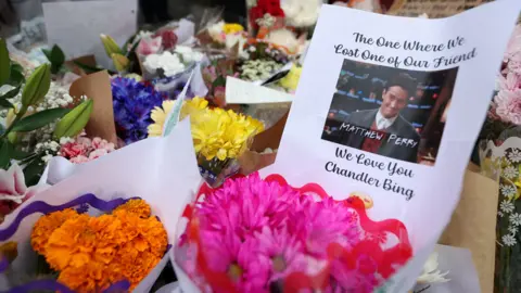 Reuters A makeshift memorial for actor Matthew Perry, the wise-cracking co-star of the 1990s hit television sitcom "Friends," who was found dead at his Los Angeles home October 28, is pictured on Bedford Street in Manhattan in New York City