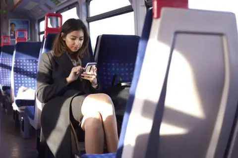 Getty Images Woman in train alone