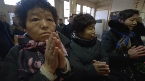 Mourners pay their respects in front of Zhao Ziyang’s tablet on the 14th anniversary of his death on Jan 17, 2019