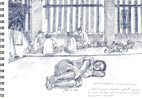 Maung Pho Kyi Pauk lying on the floor