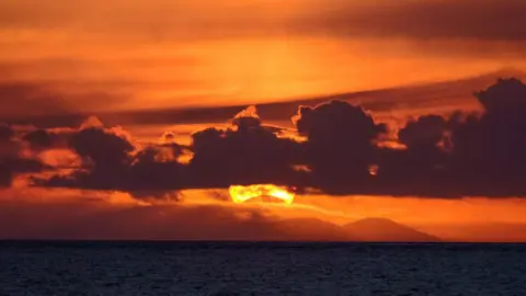 BBC Weather Watchers/ Elizabeth A partial solar eclipse glimpsed in Gairloch, the Highlands of Scotland