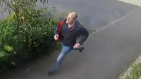 Leicestershire Police Sandall running along a pavement