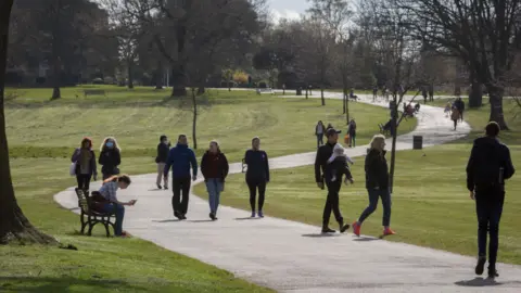 Richard Baker/Getty Londoners enjoy sunshine and spring temperatures in Brockwell Park in Herne Hill, 3 April 2020, in south London, England