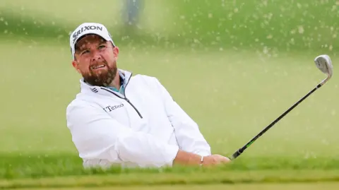 Shane Lowry chips out of the bunker at the Truist Championship