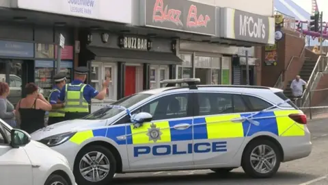 BBC Police car outside Buzz Bar
