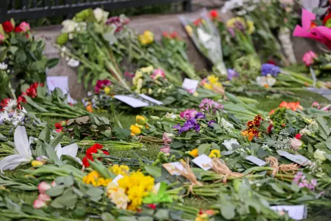 Getty Images Floral tributes are seem outside Windsor Castle