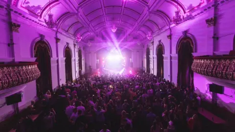 Celtronic/David Bowen/Emmet McLaughlin A large crowd is seen enjoying music while a light show is visible on stage