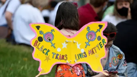 Reuters Yellow butterfly poster in on a young girl