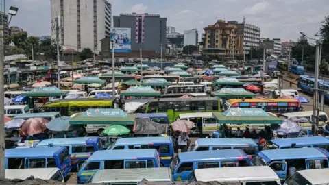 Simon Miana/AFP Mini vans waiting for customers, 12 September